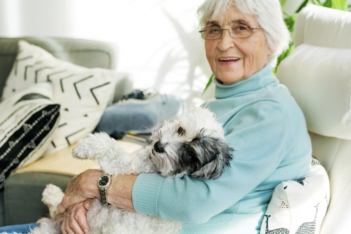 The Lodge at Stephens Lake | Senior woman with dog