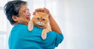 Senior with cat for the article These 5 Things Can Bring New Happiness to Seniors