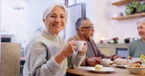 The Lodge at Stephens Lake | older female drinking coffee