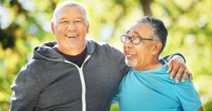 The Lodge at Stephens Lake | two senior men on a walk outside